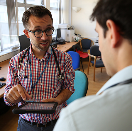 Medical education at Winchester: two men talking, one wearing a stethoscope