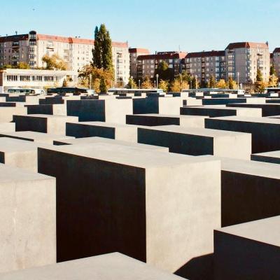 The Holocaust Memorial in Berlin against a blue sky